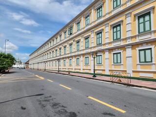 The walls of the Ministry of the Interior of Thailand have a European-style shape with striking yellow tones against the unique green window sills. It is a popular spot for tourists to take pictures.