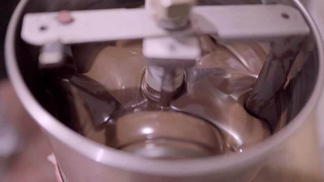 Delicious liquid chocolate mixing in conching machine