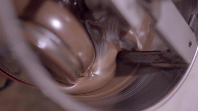Delicious liquid chocolate mixing in conching machine