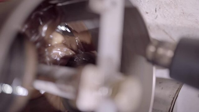 Delicious liquid chocolate mixing in conching machine