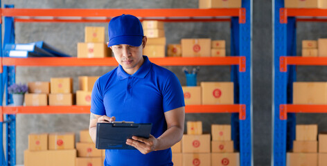 The man is in the warehouse waiting to be sold and delivered to the customers, the warehouse for...
