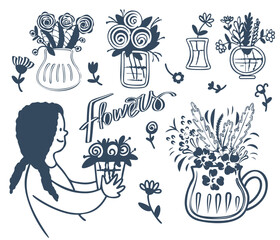 A woman with flowers in vases.