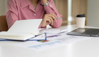 Calculation and analysis of financial statement accounting data on the desk. Financial concept tax system and budget allocation.