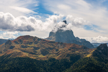 The Pic du Midi d'Ossau hidden behind some clouds and culminates at 2884 meters, west of the French Pyrenees