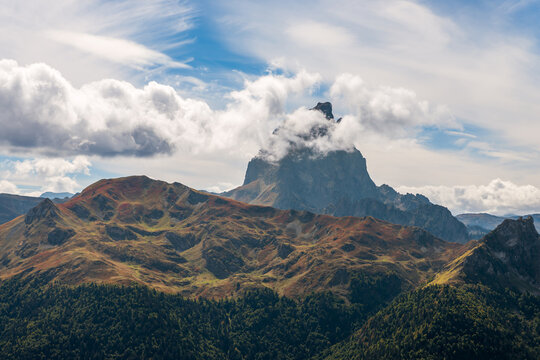 The Pic du Midi d'Ossau hidden behind some clouds and culminates at 2884 meters, west of the French Pyrenees