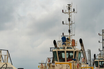 Tugboat on the pier in Southampton, Hampshire, United Kingdom on a cloudy day