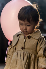 little girl with balloons