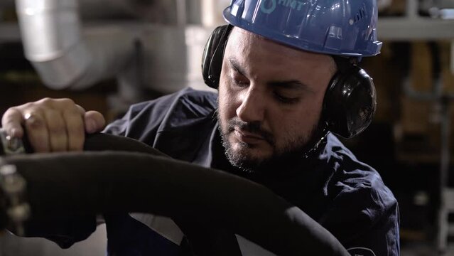 Mechanical engineer wearing works in engineering