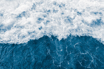 Fototapeta na wymiar Dark blue sea ocean wave and liquid white foam
