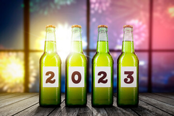 Fours beer bottles with 2023 number on table