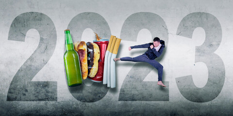 Man kicking drink and fast food with 2023 number