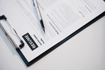Businesswoman Holding Resume,Examiner reading a resume during job interview at office Business and human resources concept.