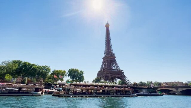 Eiffel tower in France view from the Seine river on sunny day