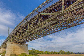 Panoramic view of an old steel railway bridge during the day