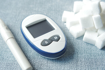 Close up of diabetic measurement tools and pills on color background 