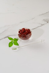 Spicy seasoning of Georgian cuisine adjika in a glass bowl