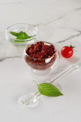 Spicy seasoning of Georgian cuisine adjika in a glass bowl