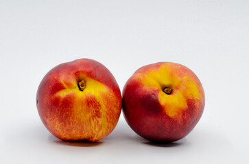 Red colored nectarines. Red nectarine fruit isolated on white background.

