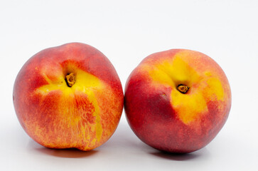 Red colored nectarines. Red nectarine fruit isolated on white background.
