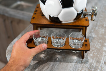 transparent glasses for alcohol mini bar in the form of a soccer ball