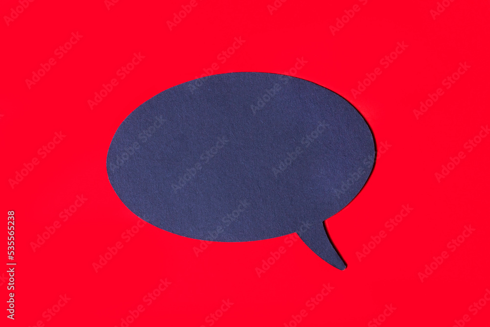 Poster a black curly card with a place to insert text on a bright red background. top view with a place to 
