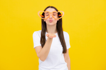 Cheerful girl In large bif funny party glasses sunglasses. Portrait of young woman wearing funny...