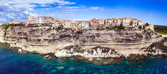 Foto op Canvas Bonifacio - splendid coastal town  in south of Corsica island, aerial drone view of houses hanging over rocks. France © Freesurf