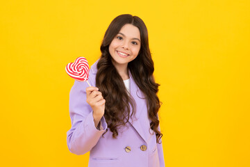 Teenager girl with caramel candies on sticks, sweet sugar addiction. Child with lollipops. Happy teenager, positive and smiling emotions of teen girl.