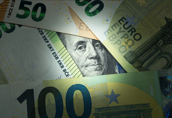 American dollars and euro money. Inflation rates. Price growth. Economy crisis, poverty, unemployment concept. Consequences of war. Hopelessness. Currency exchange rate.