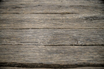 Fototapeta premium wood brown grain texture, dark wall background, top view of wood