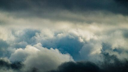Fototapeta premium Cluster of dark blue and grey storm clouds 