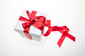 Gift box red ribbon isolated on white background, Christmas Valentine present, satin decoration