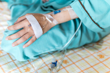 Giving saline to the hand of a patient medical treatment.