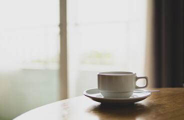 Fototapeta na wymiar Hot coffee on wooden table close up.
