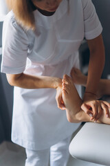 Manual therapist neurologist, chiropractor with patient. Massaging, relaxing, health care procedure for patient