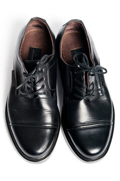 pair of mean leather shoes top down view