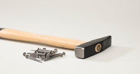 hammer with nails soft green background