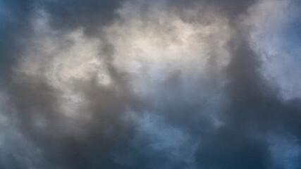 Fototapeta na wymiar Texture of bright blue dramatic cloudy sky.
