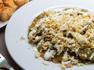 mexican food enchiladas with mole, tomato sauce, green sauce
