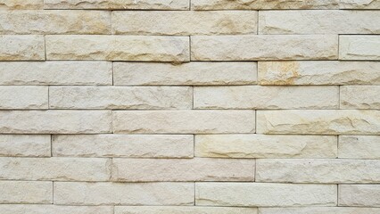 The walls are made of small cream granite.