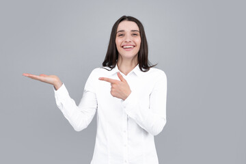 Woman point at copy space, showing copyspace pointing. Promo, girl showing advertisement content...
