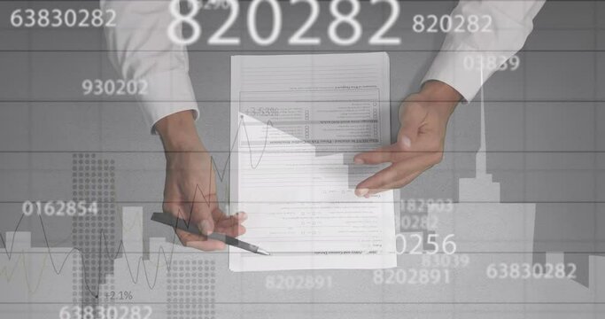 Animation of diverse financial data and graphs over hands of caucasian businessman writing