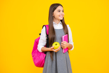 School teenage girl with book and copybook. Teenager schoolgirl student, isolated background. Learning and knowledge. Go study. Education concept.