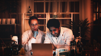 A microscope is being utilized for study in the lab by a group of scientists who are doing rigorous investigation.