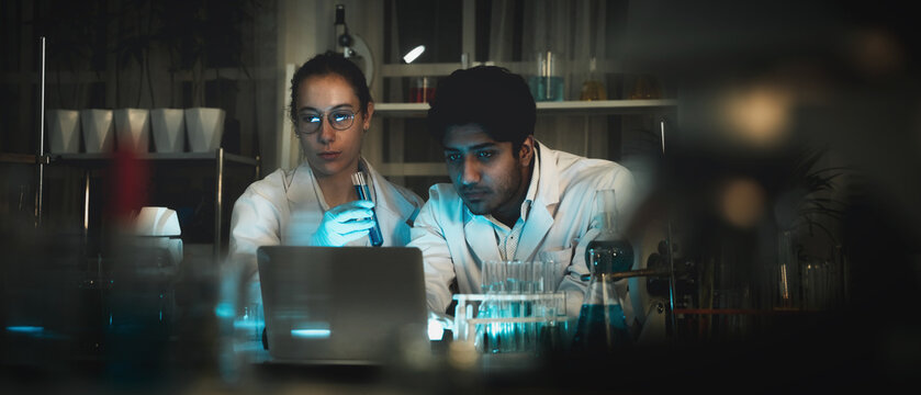 A microscope is being utilized for study in the lab by a group of scientists who are doing rigorous investigation.