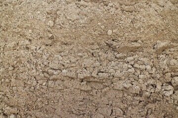 a pile of sand in the summer in the countryside