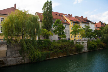 Fototapeta na wymiar The waterfront of the Ljubljanici River in central Ljubljana, Slovenia 