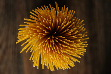 
Spaghetti on wooden background top view