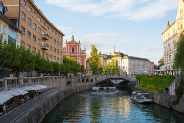 The Triple Bridge or Tromostovje over the Ljubljanici River in central Ljubljana, with the...