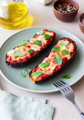 Baked eggplant with cheese mozzarella, tomatoes and basil. Healthy eating. Italian food. Parmigiana di melanzane.